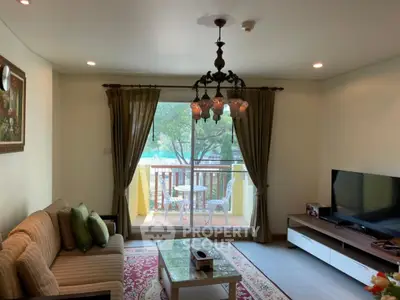 Charming living room with balcony access and elegant decor