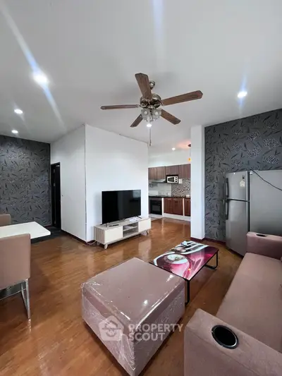 Spacious living room with modern kitchen and stylish decor