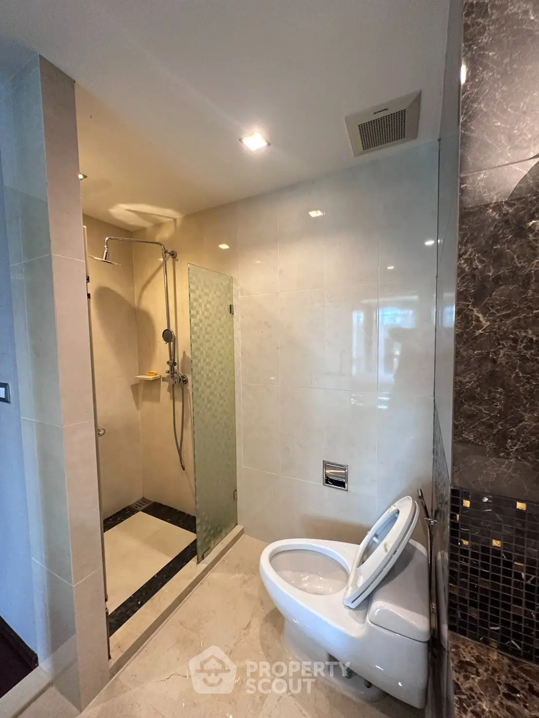 Modern bathroom with sleek shower and elegant marble accents