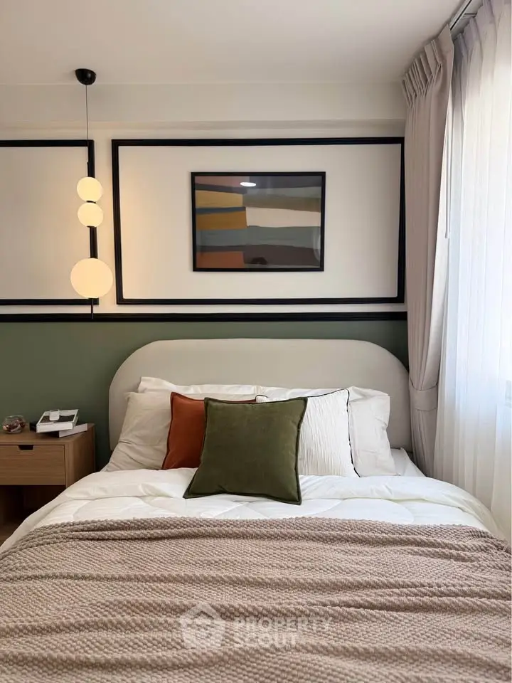 Cozy bedroom with modern decor, featuring a stylish bed, bedside table, and elegant lighting.