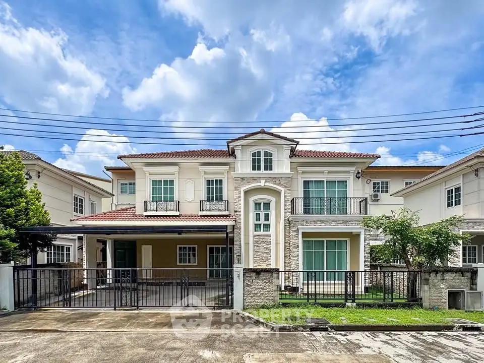 Stunning two-story house with elegant facade and spacious driveway under a clear blue sky.