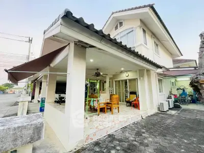 Charming two-story house with spacious patio and modern exterior design