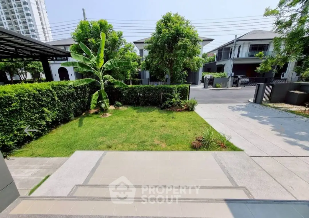 Charming suburban garden with lush greenery and modern architecture