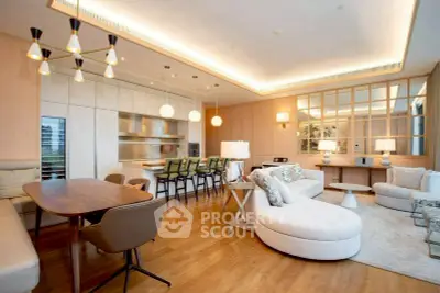 Luxurious open-plan living room with modern kitchen and elegant lighting